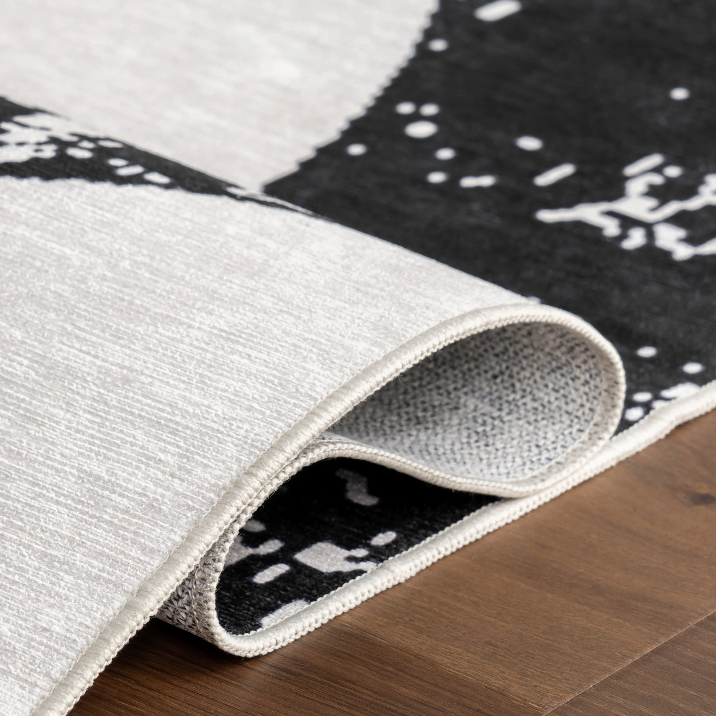 Casey Simple Serpent Spill Proof Washable Rug | Black - Image 9